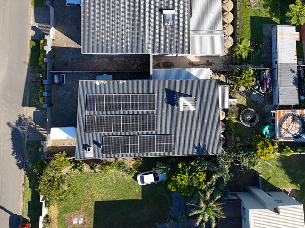 Overhead view of a home with rooftop solar panels