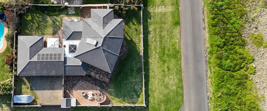 Overhead view of a home, garden and surrounding roads